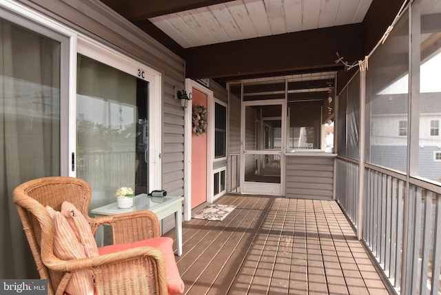 sunroom / solarium with beam ceiling