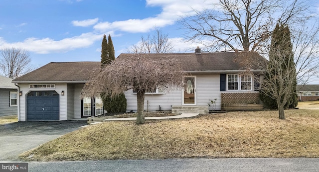 single story home featuring a garage