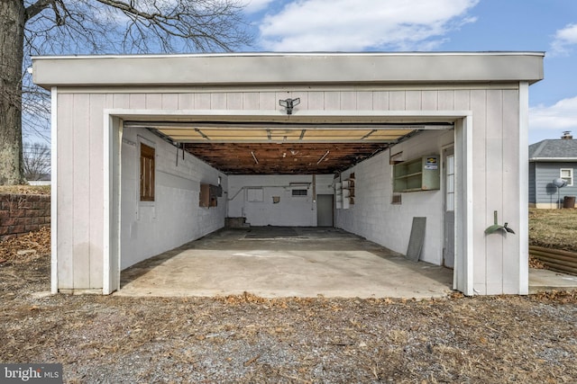 view of car parking featuring a garage