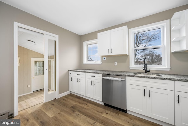 kitchen featuring sink, wood-type flooring, dishwasher, stone counters, and white cabinets