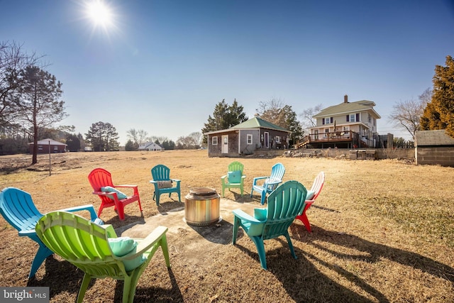 view of yard with a fire pit