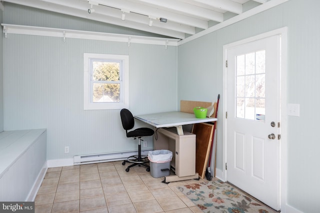 home office with lofted ceiling, light tile patterned floors, and a baseboard heating unit