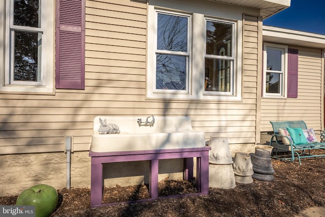 view of side of property with sink