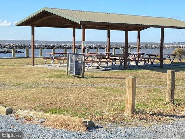 view of community with a water view, a gazebo, and a lawn