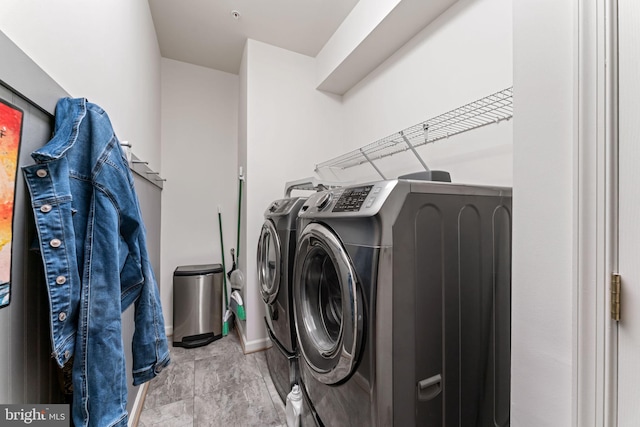 laundry room featuring washer and clothes dryer