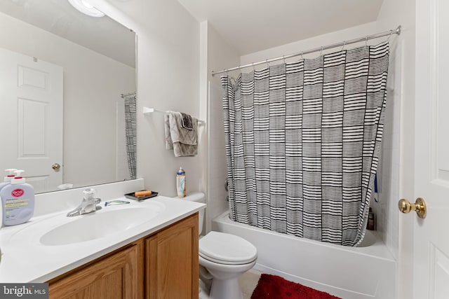 full bathroom with vanity, shower / bath combination with curtain, and toilet