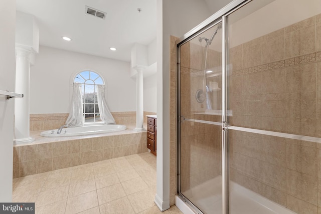 bathroom featuring vanity, tile patterned flooring, shower with separate bathtub, and ornate columns