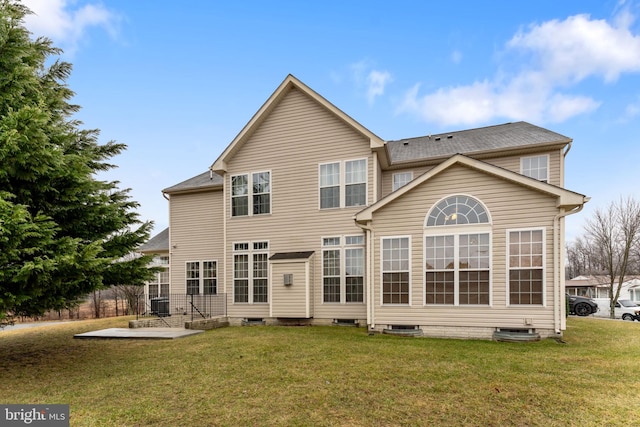 back of house with cooling unit, a patio, and a lawn