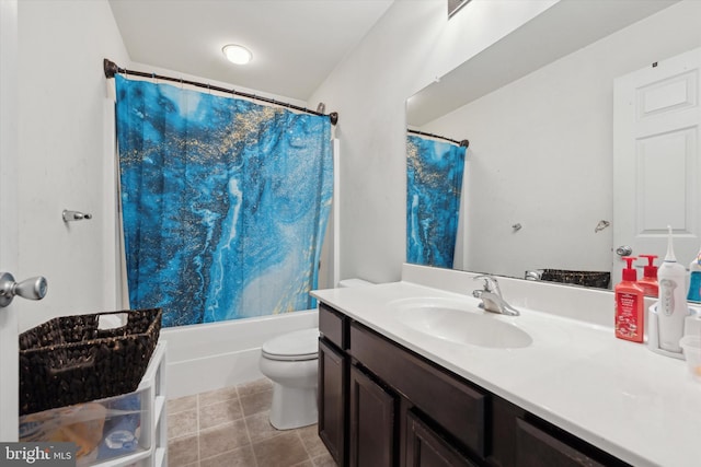 full bathroom with tile patterned floors, vanity, toilet, and shower / bath combo