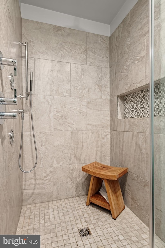 bathroom with tiled shower