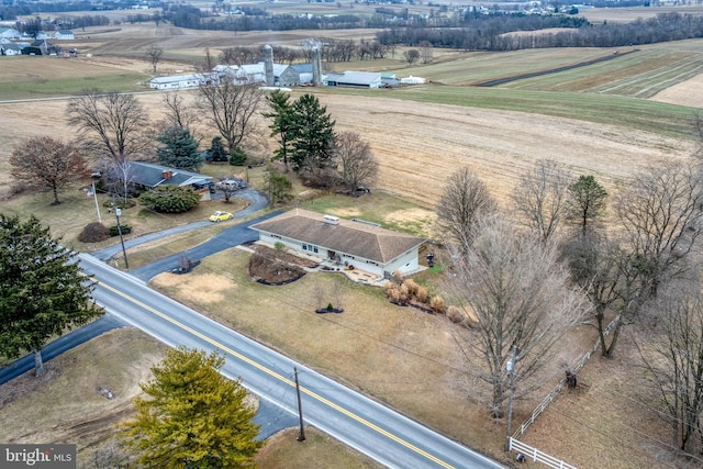 birds eye view of property featuring a rural view