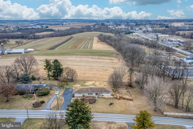 birds eye view of property with a rural view