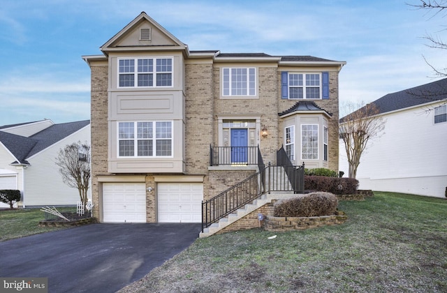 view of front of home featuring a garage and a front lawn