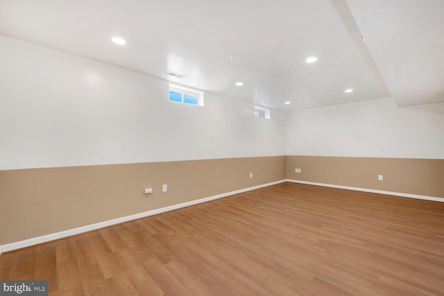 empty room with light hardwood / wood-style floors