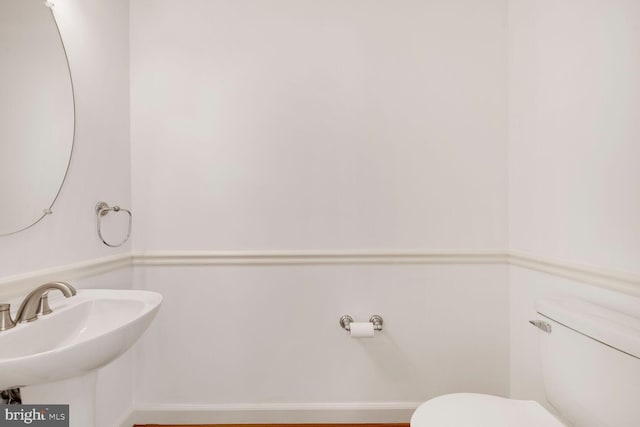 bathroom featuring sink and toilet