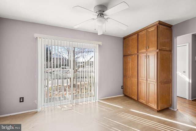 unfurnished bedroom featuring ceiling fan