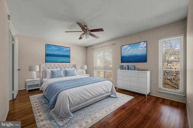 bedroom featuring ceiling fan and dark hardwood / wood-style flooring