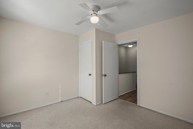 unfurnished bedroom with ceiling fan and carpet flooring