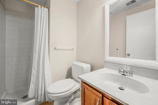 bathroom featuring vanity, toilet, and a shower with shower curtain