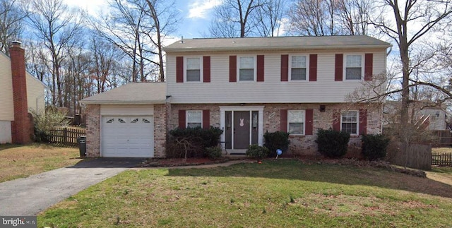 view of front of home with a garage and a front yard