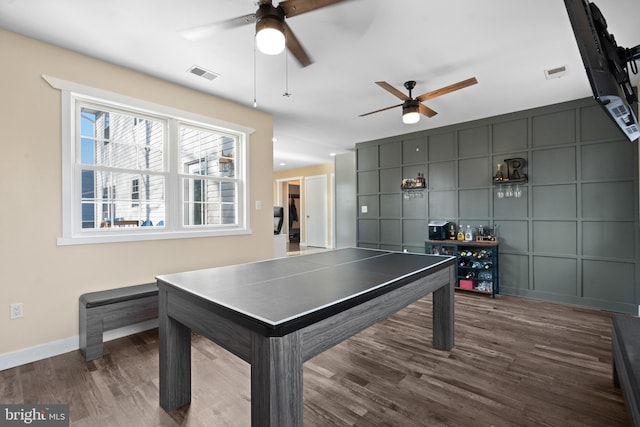 game room with dark hardwood / wood-style flooring and ceiling fan