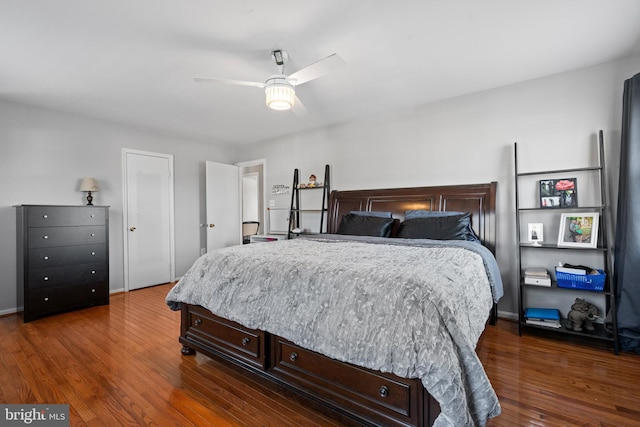 bedroom featuring ceiling fan and dark hardwood / wood-style floors