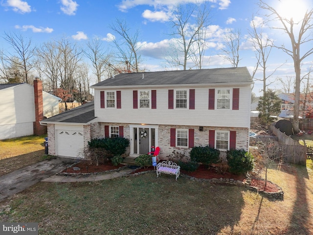 view of front of home featuring a garage and a front lawn