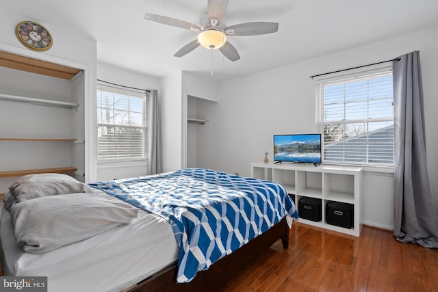 bedroom with ceiling fan and hardwood / wood-style floors