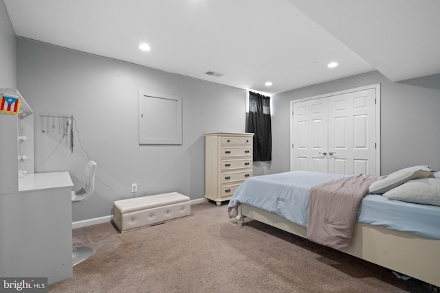 bedroom with a closet and carpet flooring