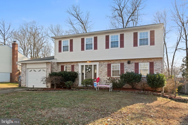 view of front of property with a garage and a front yard