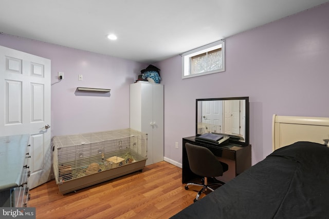 bedroom with light wood-type flooring