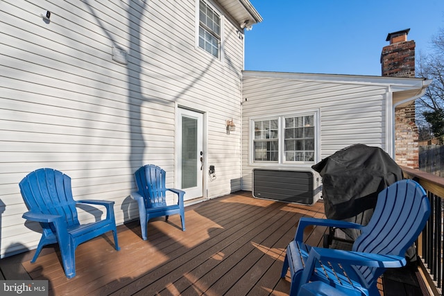 wooden deck featuring grilling area