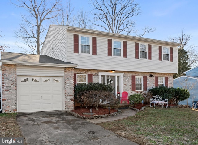 view of front of property featuring a garage and a front lawn