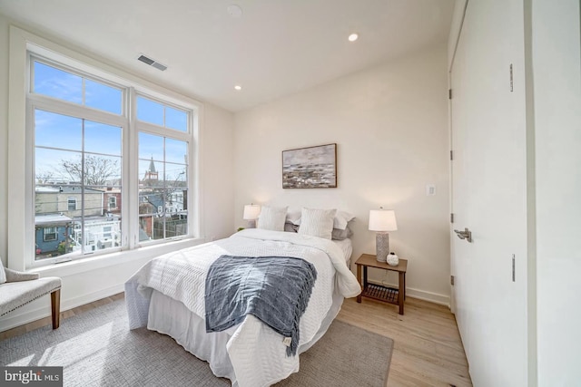 bedroom with light wood-type flooring