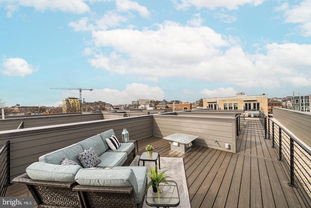 wooden deck with an outdoor living space