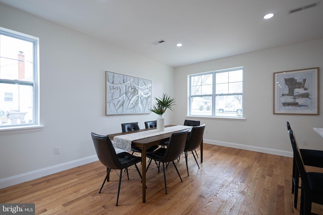 dining space featuring light wood-type flooring