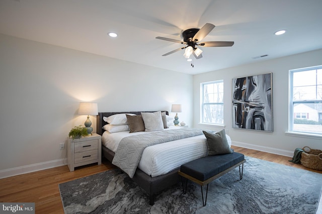 bedroom featuring hardwood / wood-style floors and ceiling fan