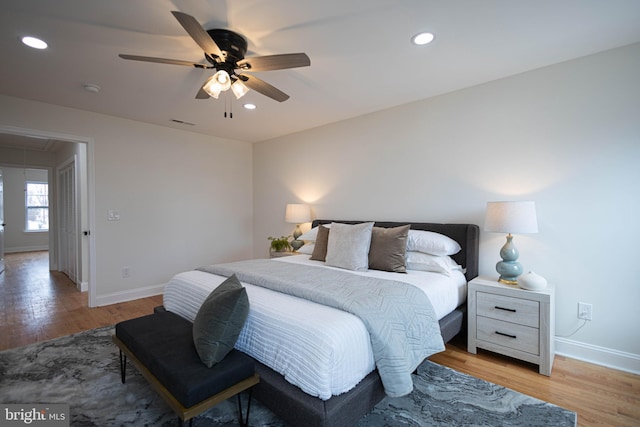 bedroom featuring light hardwood / wood-style flooring and ceiling fan