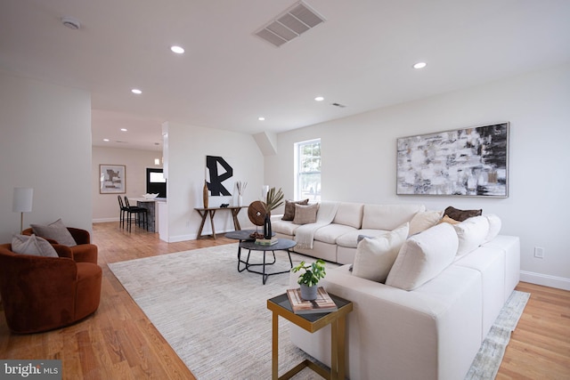 living room with light hardwood / wood-style flooring