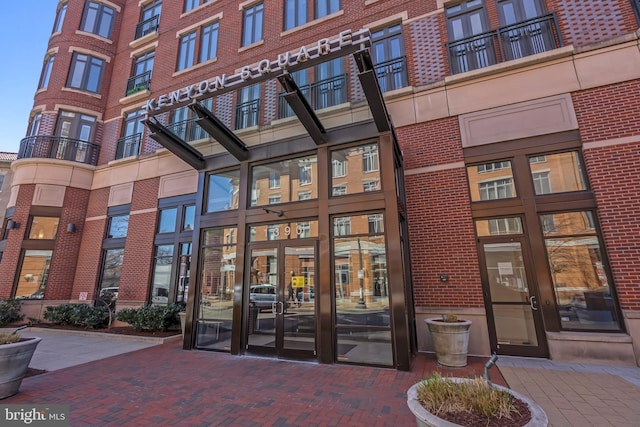 entrance to property with brick siding