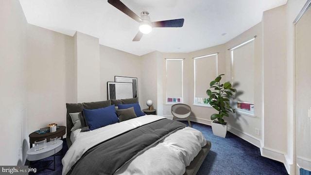 carpeted bedroom featuring ceiling fan