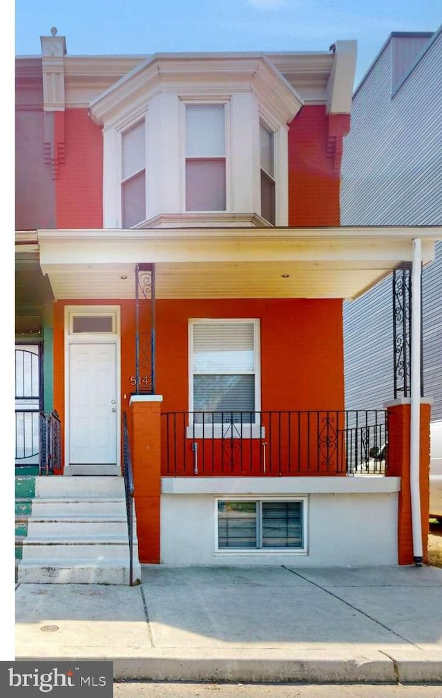 view of property featuring a porch