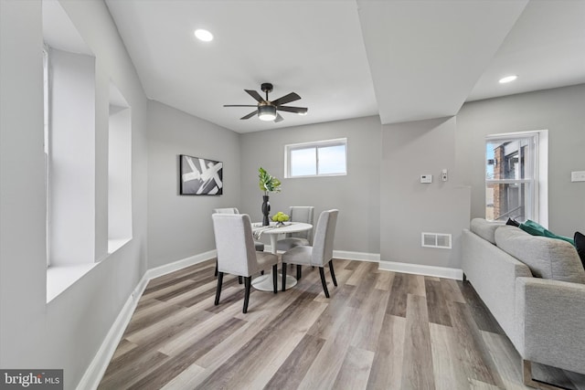 dining area with baseboards, visible vents, wood finished floors, and recessed lighting