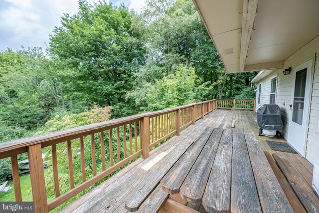 wooden deck featuring grilling area