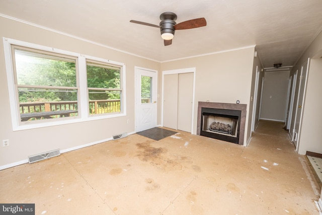 unfurnished living room featuring ceiling fan and ornamental molding