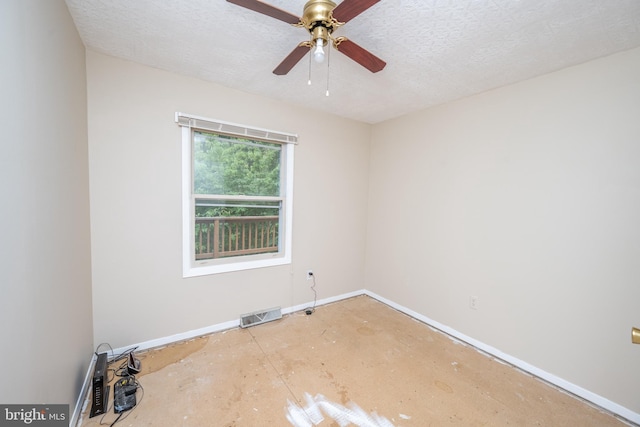 spare room with ceiling fan and a textured ceiling