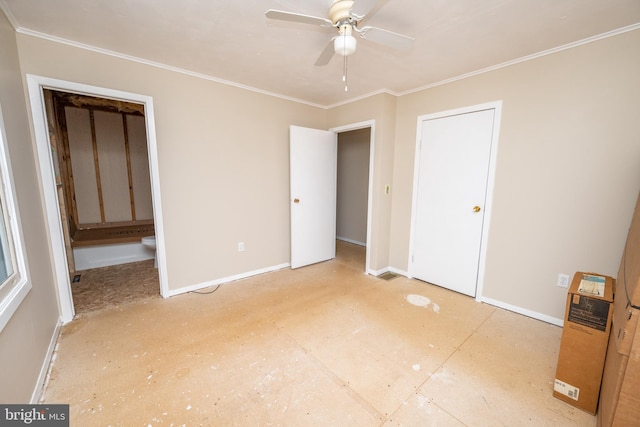 unfurnished bedroom with crown molding and connected bathroom