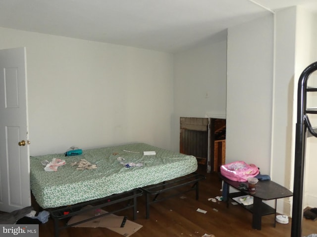 bedroom featuring dark hardwood / wood-style flooring