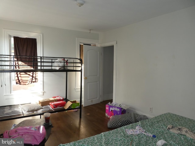 bedroom with hardwood / wood-style floors