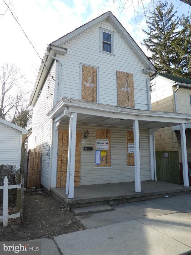 back of house featuring covered porch